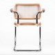 Replica of the Cesca Chair with armrests by designer Marcel Breuer